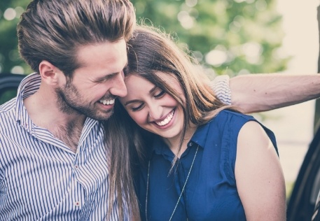 Couple with healthy smiles after visiting the dentist