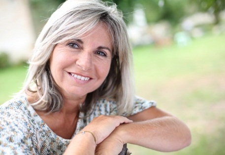 Woman with flawless smile after cosmetic dental bonding