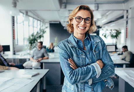 Woman smiling with a dental bridge in Dallas