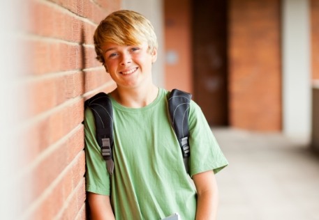 Young boy with healthy smile after his first children's dentistry visit