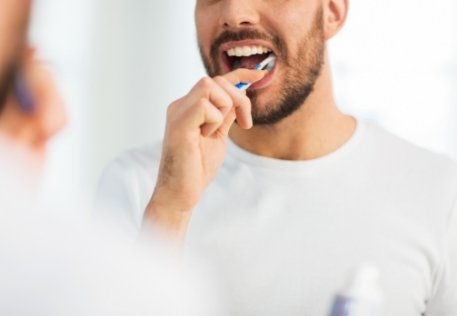 Man brushing teeth