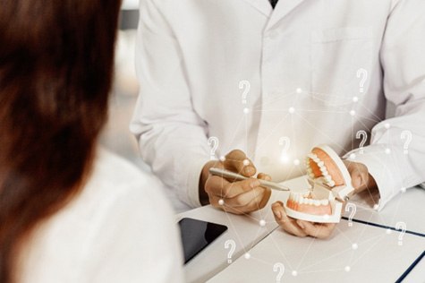 A dentist consulting with a patient