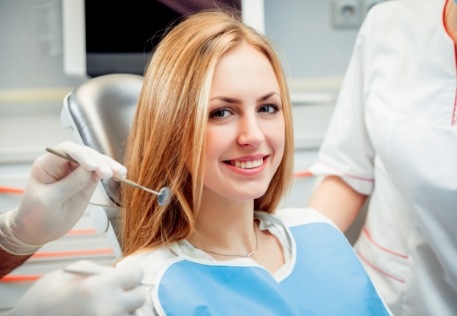Woman smiling during delta dental dentist visit