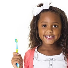 little girl with a toothbrush