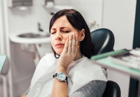 Woman in pain before emergency dentistry