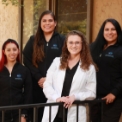 Four dental team members in dental office