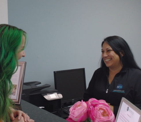 Dental patient advocate Amanda talking to dental patient in Dallas