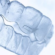 a closeup of a pair of Invisalign trays