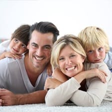 Family smiling at home