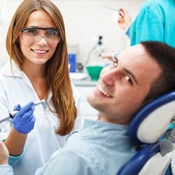 Smiling man in dental chair