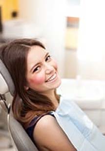 Woman smiling during preventive dentistry visit