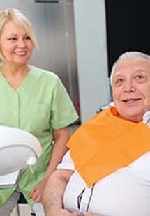 Man discussing tooth replacement with dental implants