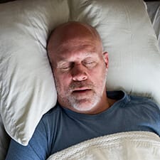 man peacefully sleeping