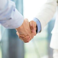 dentist and patient shaking hands