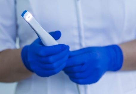 Dentist holding an intraoral camera