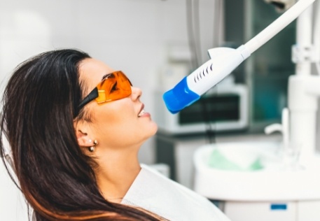 Woman receiving in office teeth whitening