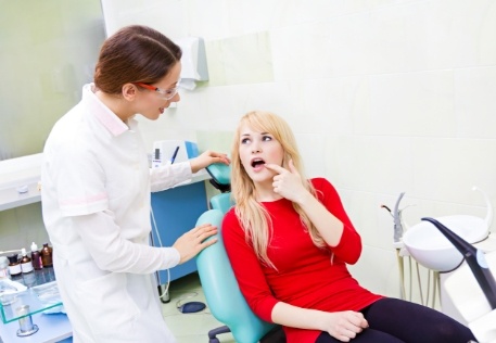 Woman discussing what to expect following tooth extractions