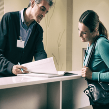 Dentist helping patient with dental insurance