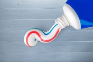 A line of toothpaste being squeezed