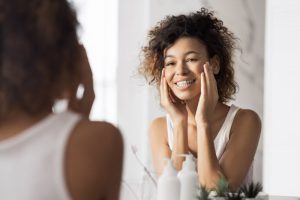 person smiling in mirror