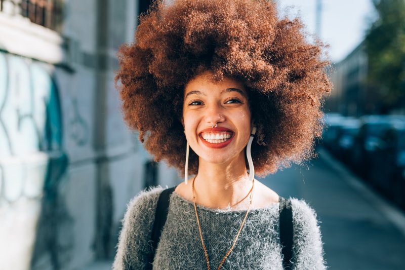 person with porcelain veneers smiling