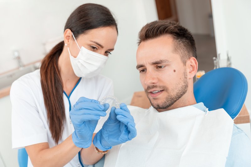 Man at dentist getting Invisalign