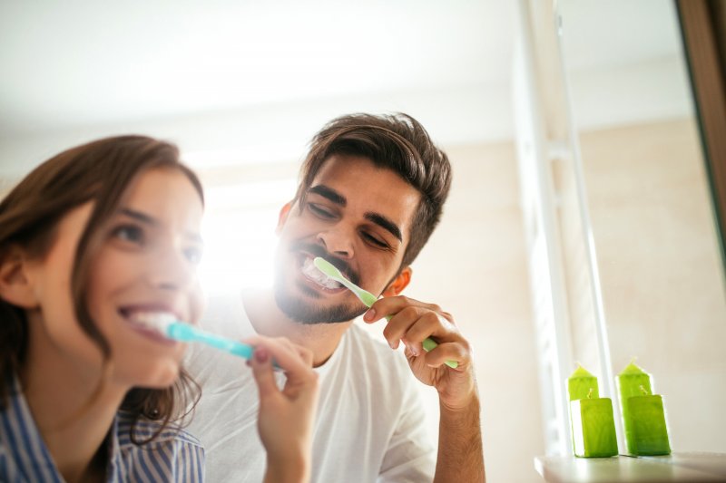 couple brushing their teeth in Dallas