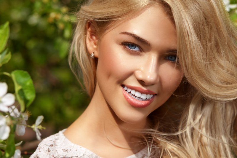 woman smiling with bright teeth in Dallas