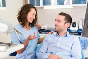 Dentist consulting with patient.